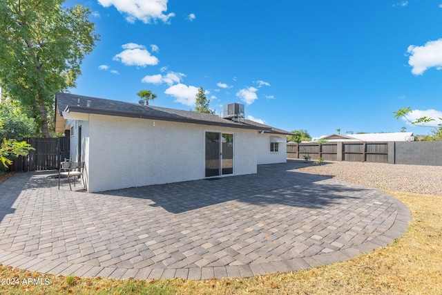 back of house with a patio and central AC