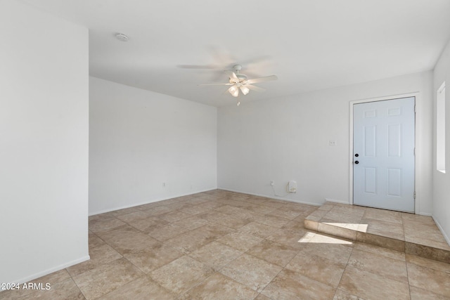 unfurnished room with ceiling fan