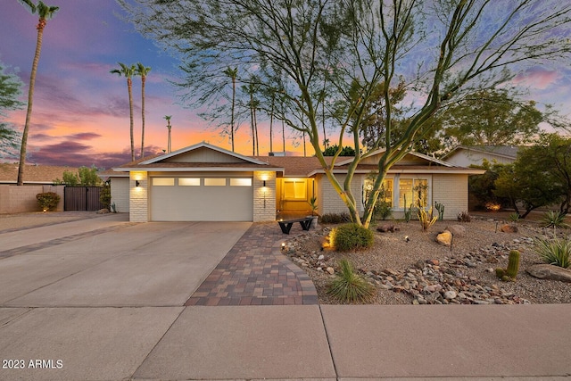 11822 S Coconino St, Phoenix, AZ 85044 - view of front of home featuring brick siding, driveway, and an attached garage