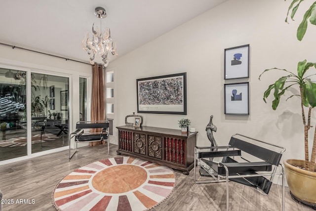 11822 S Coconino St, Phoenix, AZ 85044 - sitting room featuring vaulted ceiling, wood finished floors, and a chandelier