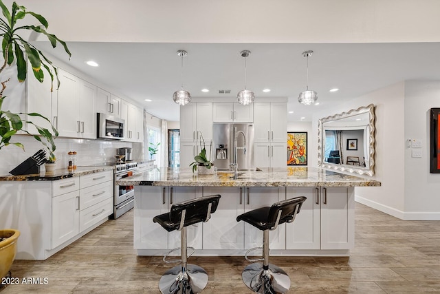 11822 S Coconino St, Phoenix, AZ 85044 - kitchen with stainless steel appliances, baseboards, a sink, recessed lighting, and white cabinetry