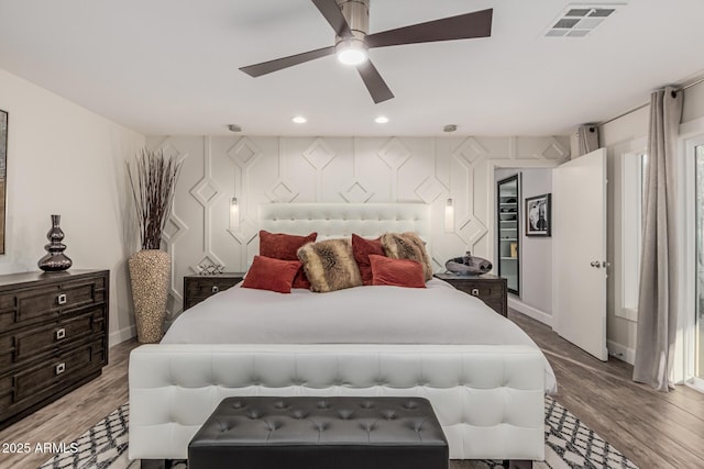 11822 S Coconino St, Phoenix, AZ 85044 - bedroom with a ceiling fan, light wood-type flooring, baseboards, and recessed lighting
