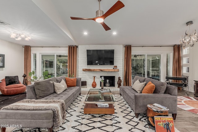 11822 S Coconino St, Phoenix, AZ 85044 - living area featuring a ceiling fan, a brick fireplace, and recessed lighting