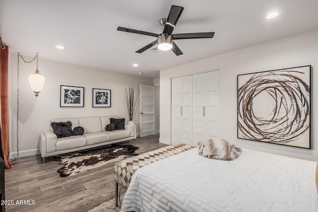 11822 S Coconino St, Phoenix, AZ 85044 - bedroom featuring baseboards, wood finished floors, a closet, recessed lighting, and a ceiling fan