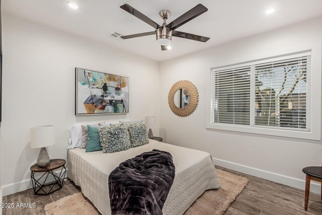 11822 S Coconino St, Phoenix, AZ 85044 - bedroom with baseboards, wood finished floors, recessed lighting, and a ceiling fan