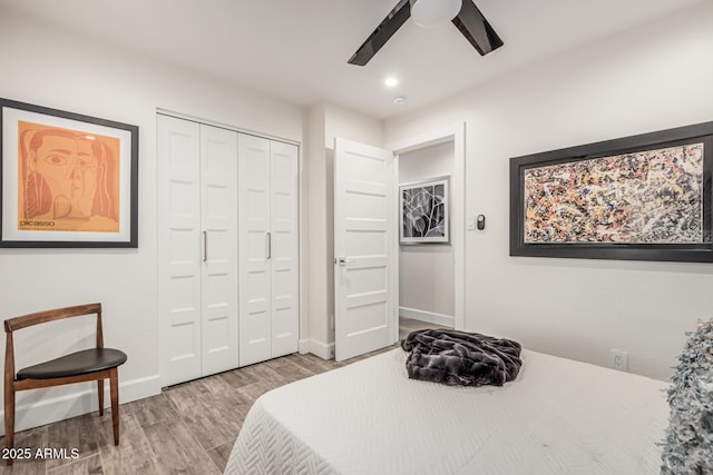 11822 S Coconino St, Phoenix, AZ 85044 - bedroom with wood finished floors, a closet, baseboards, a ceiling fan, and recessed lighting