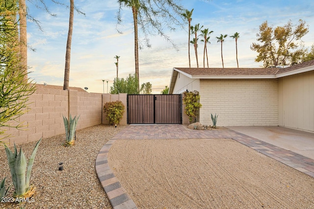11822 S Coconino St, Phoenix, AZ 85044 - yard at dusk featuring a gate