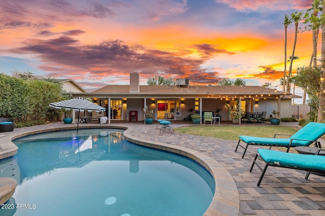 11822 S Coconino St, Phoenix, AZ 85044 - swimming pool featuring a patio area and central AC unit