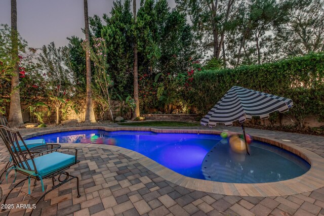 11822 S Coconino St, Phoenix, AZ 85044 - pool at dusk featuring a patio and a fenced backyard