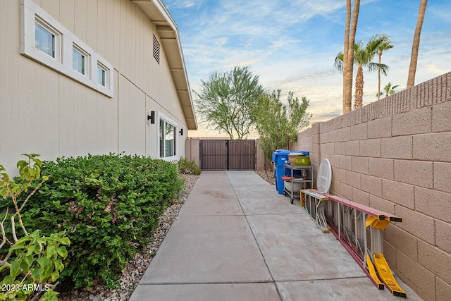 11822 S Coconino St, Phoenix, AZ 85044 - view of property exterior with a gate and a patio