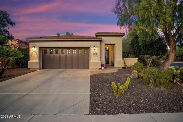 view of front of home with a garage