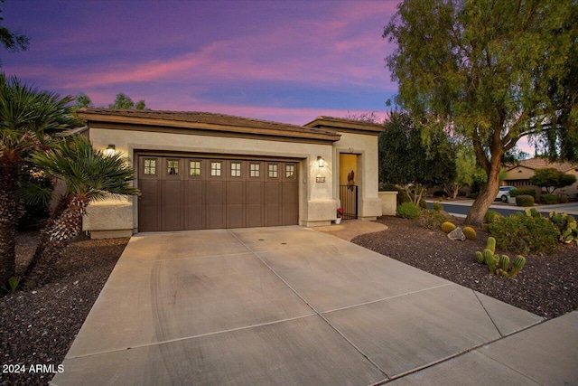 view of front of property with a garage