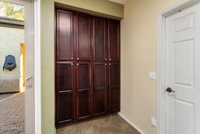 hall featuring tile patterned floors