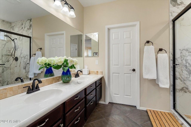 bathroom with tile patterned flooring, vanity, and a shower with door