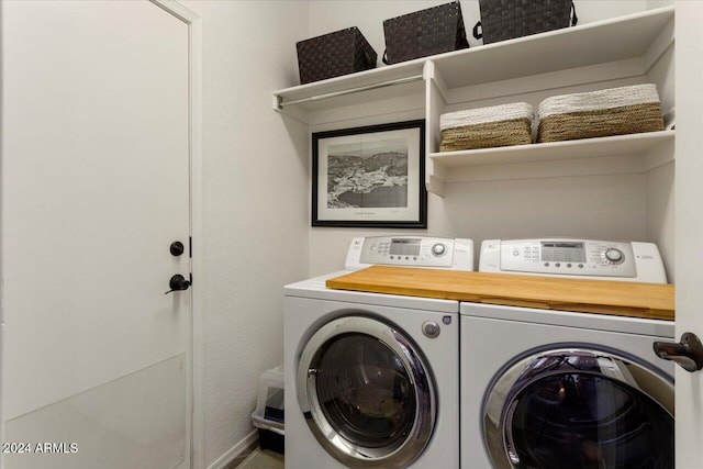 clothes washing area featuring washer and dryer