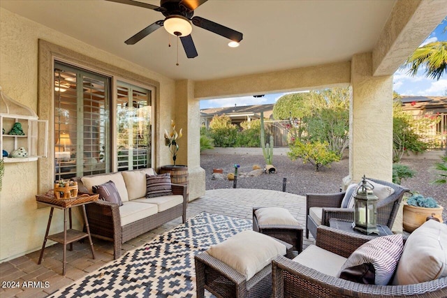 view of patio with ceiling fan and an outdoor living space