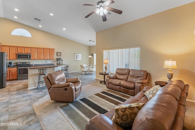 44574 W High Desert Trl, Maricopa, AZ 85139 - living area with visible vents, plenty of natural light, high vaulted ceiling, and ceiling fan
