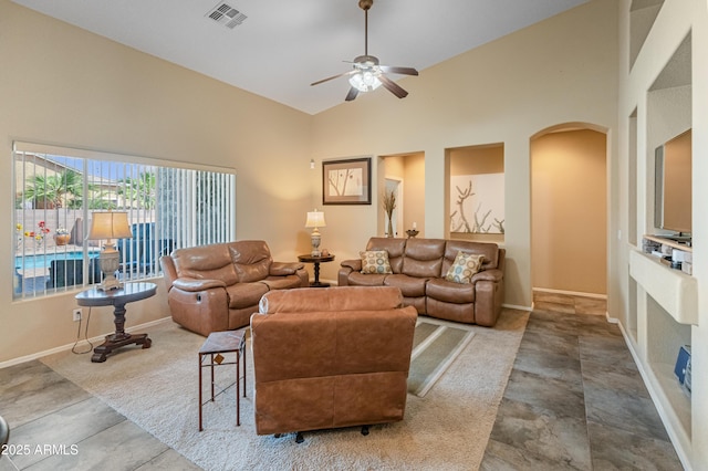 44574 W High Desert Trl, Maricopa, AZ 85139 - living area featuring visible vents, baseboards, ceiling fan, high vaulted ceiling, and arched walkways