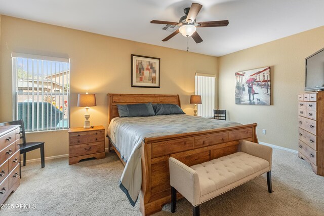 44574 W High Desert Trl, Maricopa, AZ 85139 - bedroom featuring light colored carpet, a ceiling fan, and baseboards