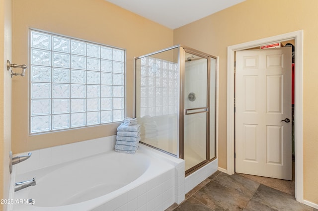 44574 W High Desert Trl, Maricopa, AZ 85139 - full bathroom with tile patterned floors, a shower stall, and a bath