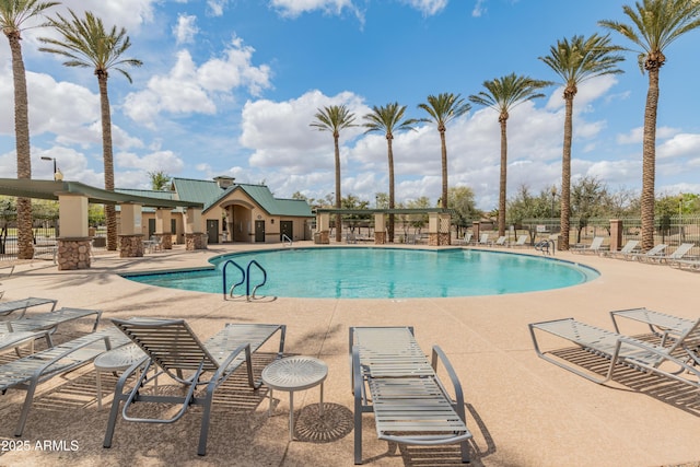 44574 W High Desert Trl, Maricopa, AZ 85139 - community pool with a patio area and fence