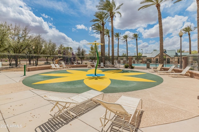 44574 W High Desert Trl, Maricopa, AZ 85139 - view of home's community featuring a swimming pool, fence, and a patio