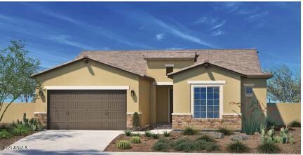 view of front facade with a garage, brick siding, driveway, and stucco siding