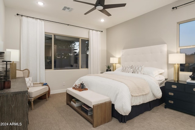 carpeted bedroom with a ceiling fan, recessed lighting, and visible vents