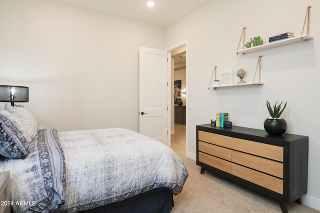 bedroom with light carpet, recessed lighting, and baseboards