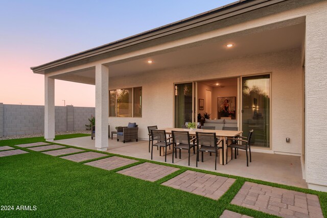 view of patio with outdoor dining area and fence