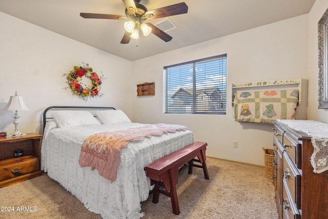 bedroom featuring light colored carpet and ceiling fan