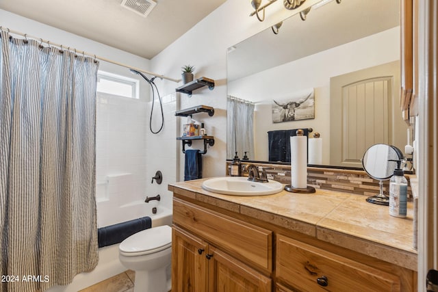 full bathroom with vanity, shower / tub combo with curtain, toilet, and tile patterned floors