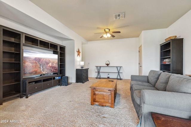 carpeted living room featuring ceiling fan