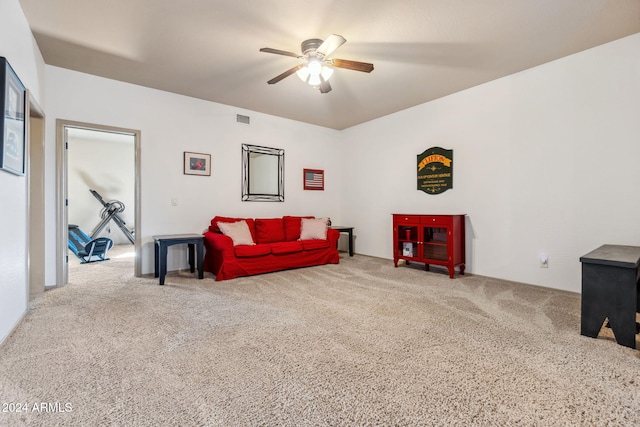 carpeted living room with ceiling fan