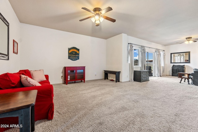 living room featuring ceiling fan and light colored carpet