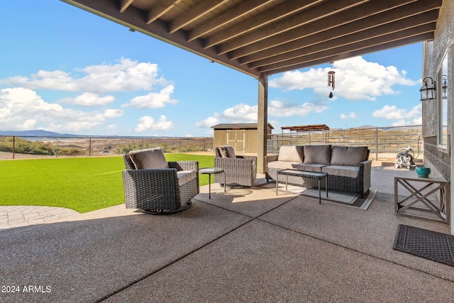 view of patio with a storage unit and an outdoor living space