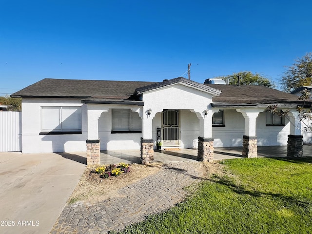 view of front of home featuring a front yard and a porch