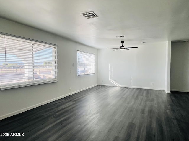 interior space featuring ceiling fan and dark hardwood / wood-style flooring