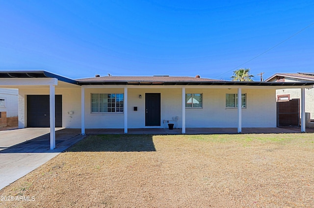 ranch-style house featuring a carport and a garage