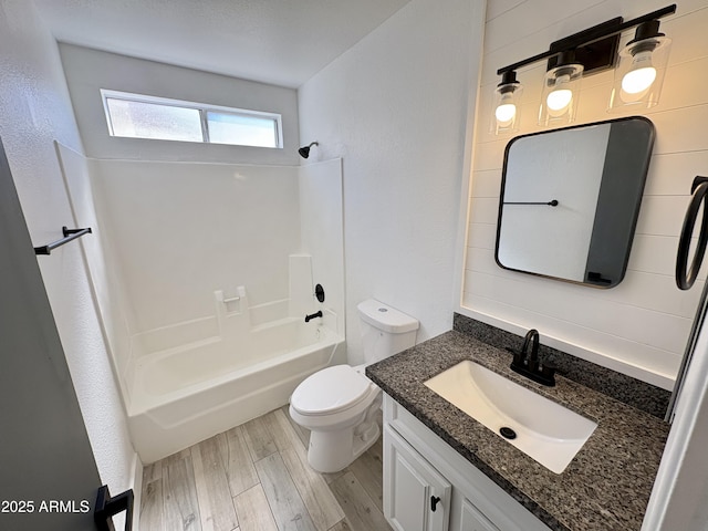 6419 W Monte Cristo Ave, Glendale, AZ 85306 - full bathroom with shower / bathtub combination, vanity, toilet, and wood finished floors
