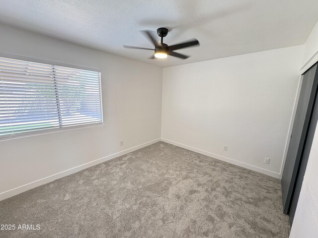 6419 W Monte Cristo Ave, Glendale, AZ 85306 - carpeted spare room with a ceiling fan and baseboards