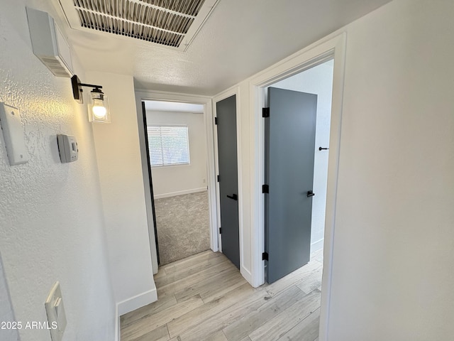 6419 W Monte Cristo Ave, Glendale, AZ 85306 - hallway featuring light wood finished floors and baseboards
