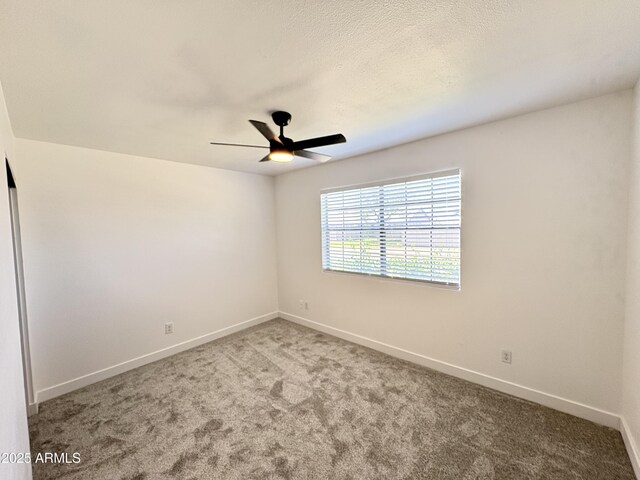 6419 W Monte Cristo Ave, Glendale, AZ 85306 - empty room featuring a ceiling fan, carpet flooring, and baseboards