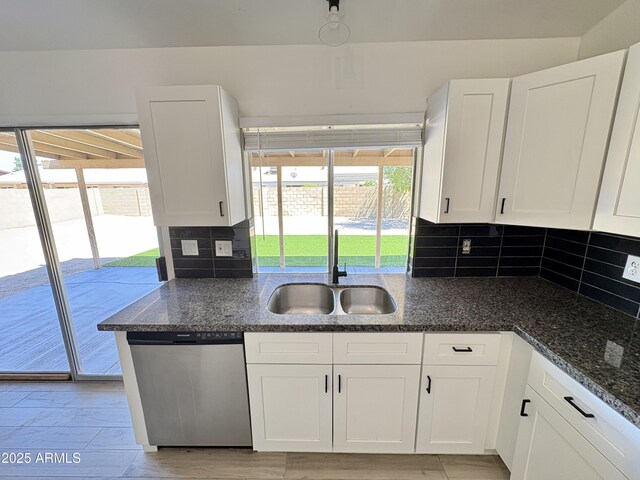 6419 W Monte Cristo Ave, Glendale, AZ 85306 - kitchen with dishwasher, a sink, white cabinetry, decorative backsplash, and healthy amount of natural light