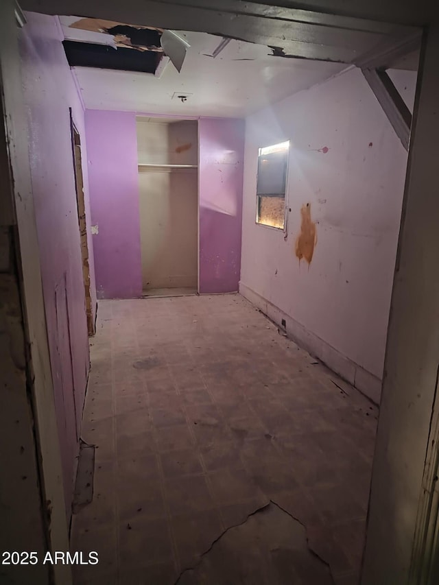 hallway with tile patterned floors