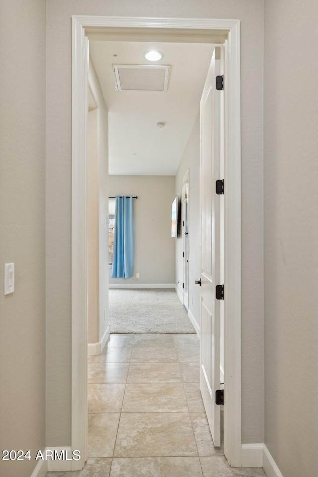 corridor with light colored carpet