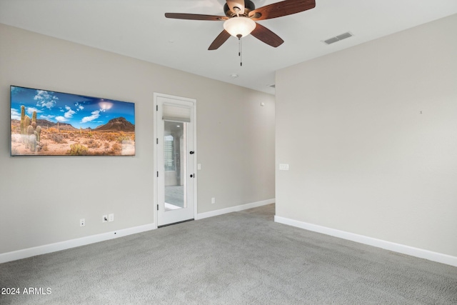 empty room with carpet floors and ceiling fan