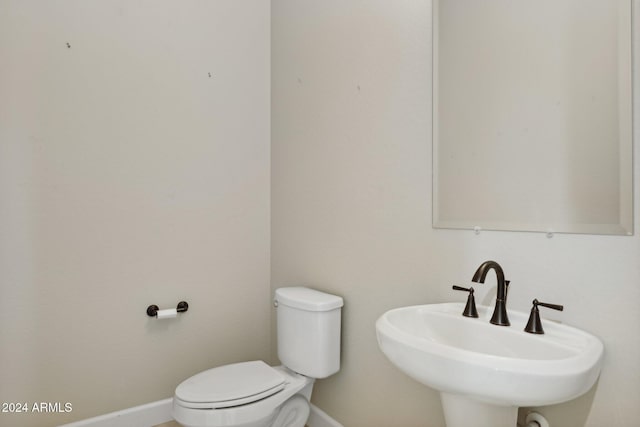 bathroom featuring sink and toilet