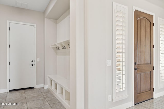 mudroom with light tile patterned floors