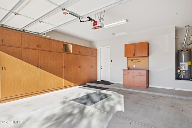 garage with gas water heater and a garage door opener